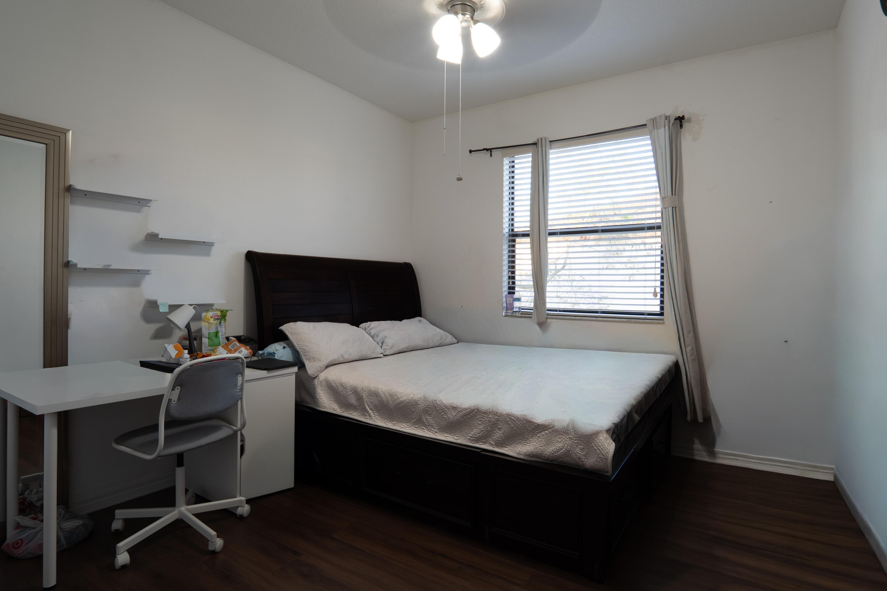 3573 Southwest 92nd Avenue Miramar, FL 33025 - Photo 22 of 24 a bedroom with a bed and a window