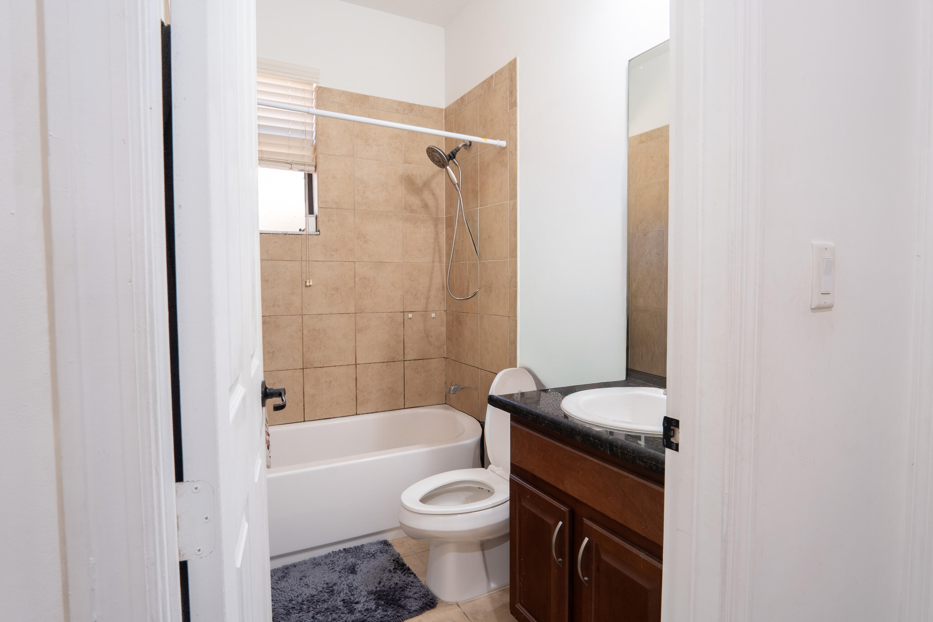 3573 Southwest 92nd Avenue Miramar, FL 33025 - Photo 24 of 24 a bathroom with a toilet a sink and bathtub