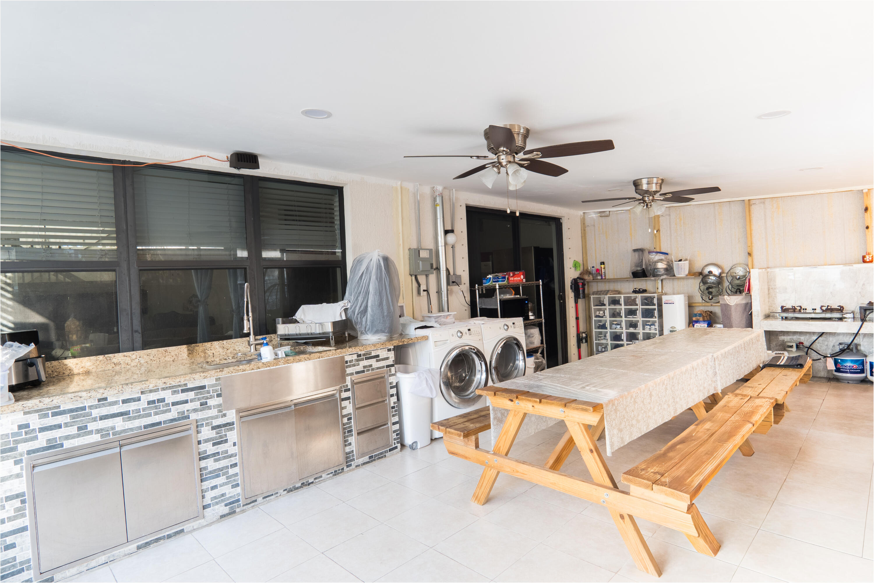 3573 Southwest 92nd Avenue Miramar, FL 33025 - Photo 8 of 24 a view of living room kitchen with granite countertop furniture and fireplace