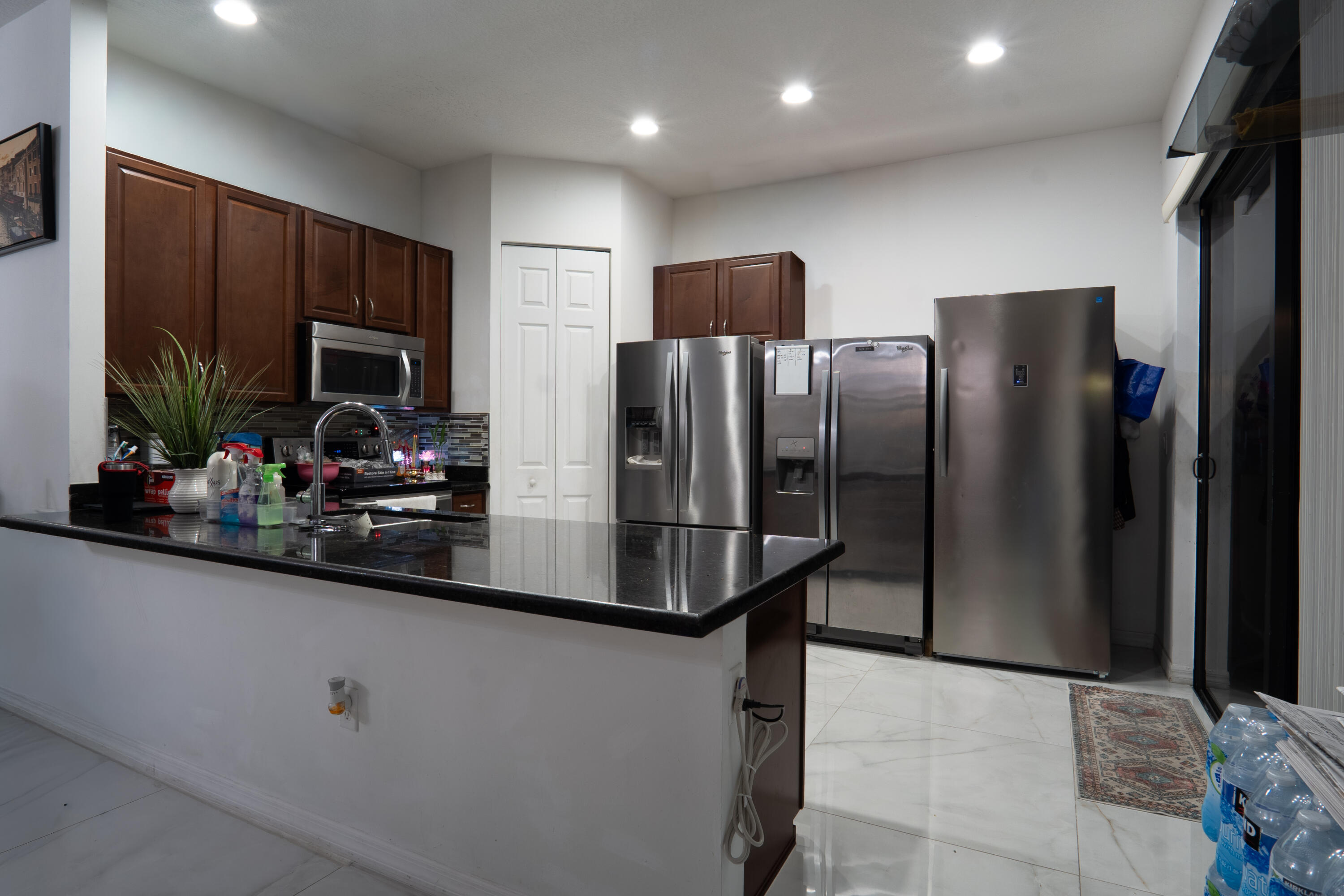 3573 Southwest 92nd Avenue Miramar, FL 33025 - Photo 10 of 24 a kitchen with stainless steel appliances a refrigerator and a sink