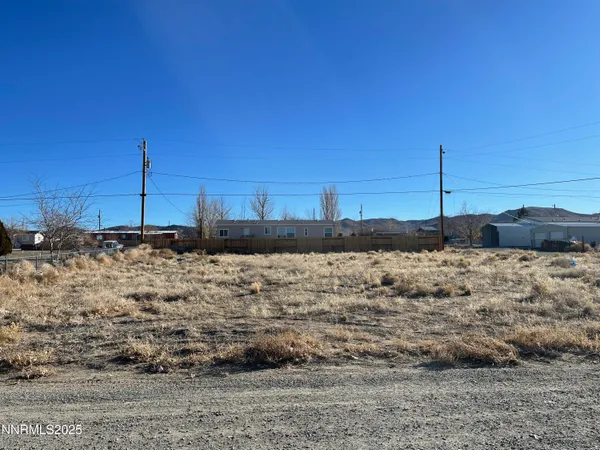 a view of yard covered with snow