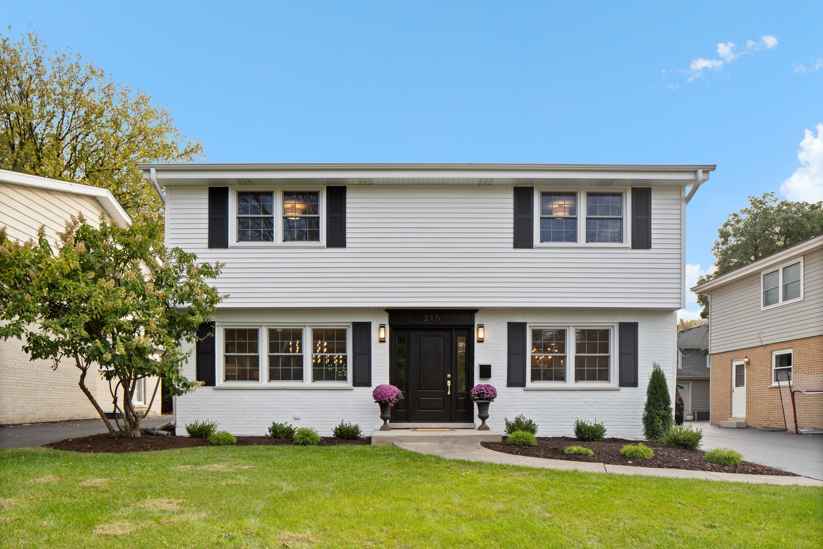 a house view with a sitting space and garden space