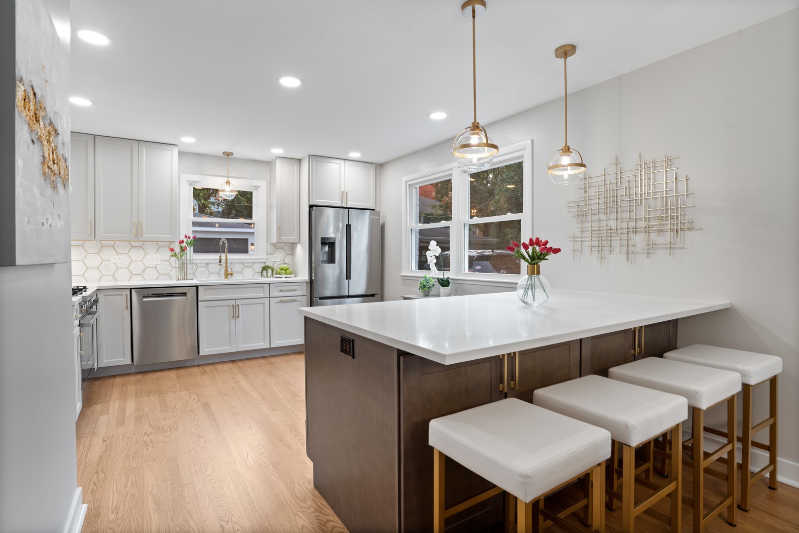 215 45th Street Western Springs, IL 60558 - Photo 19 of 46 a kitchen with a table chairs sink and wooden floor