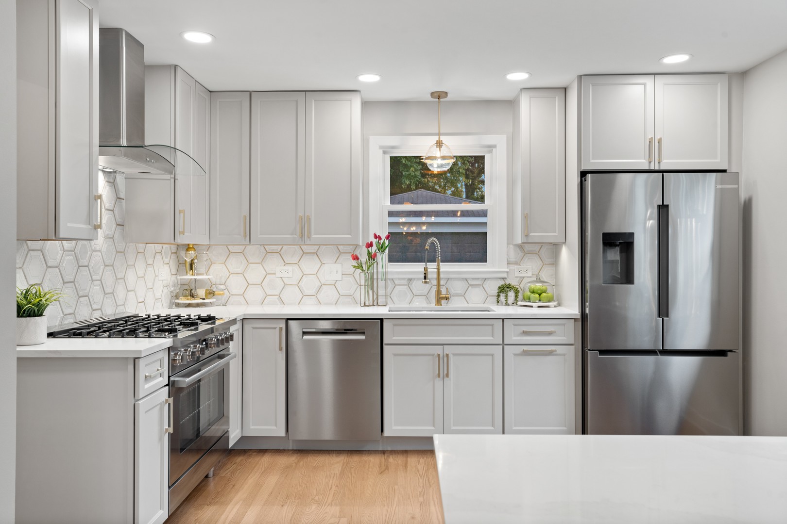 215 45th Street Western Springs, IL 60558 - Photo 20 of 46 a kitchen with kitchen island stainless steel appliances a refrigerator a sink and a stove