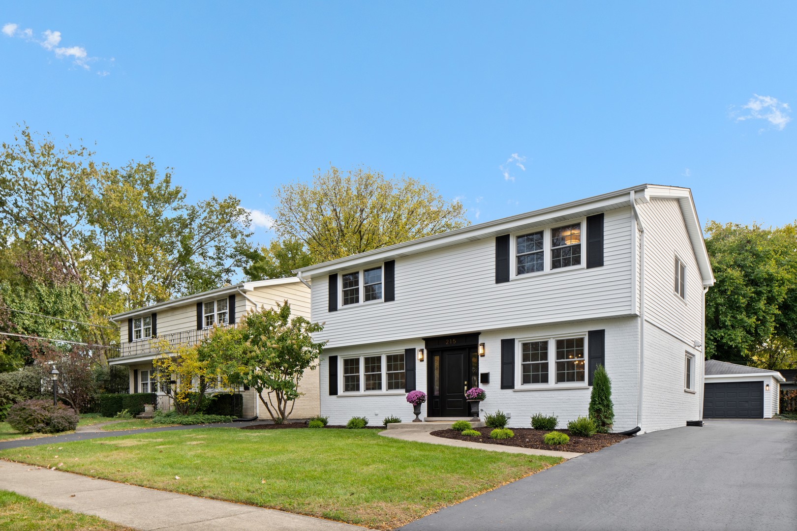 215 45th Street Western Springs, IL 60558 - Photo 2 of 46 a front view of a house with garden