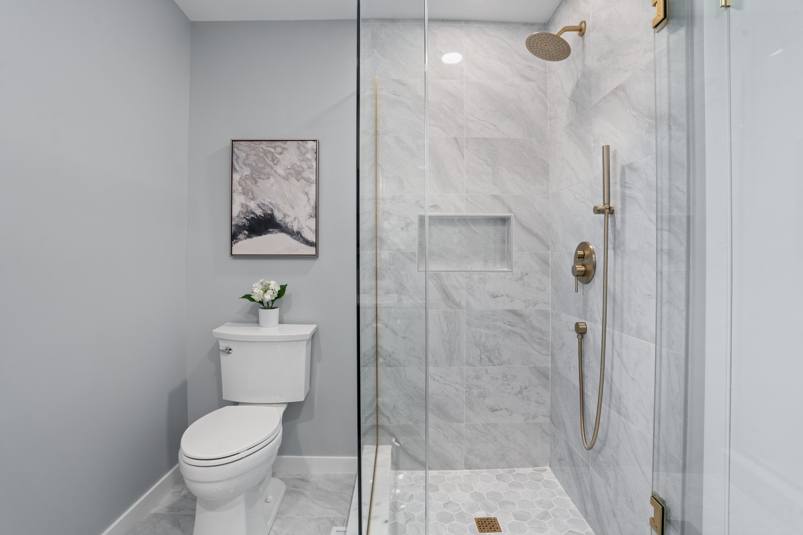 215 45th Street Western Springs, IL 60558 - Photo 28 of 46 a white toilet sitting next to a bathroom sink