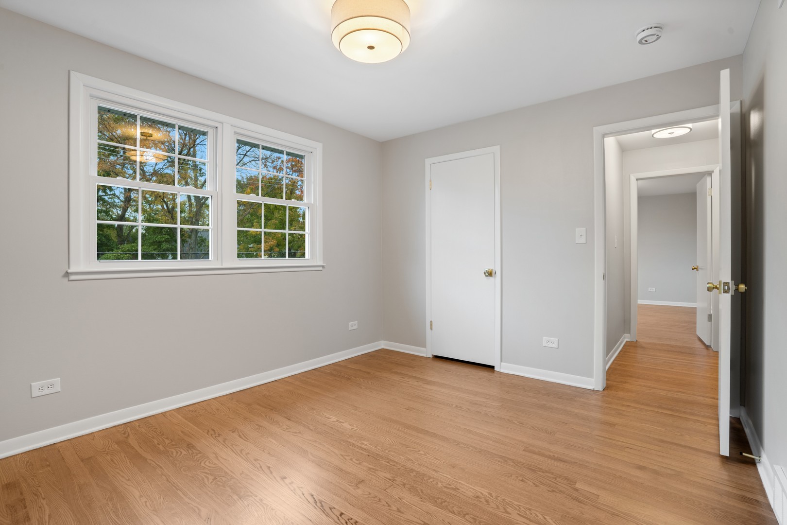 215 45th Street Western Springs, IL 60558 - Photo 32 of 46 an empty room with wooden floor and windows