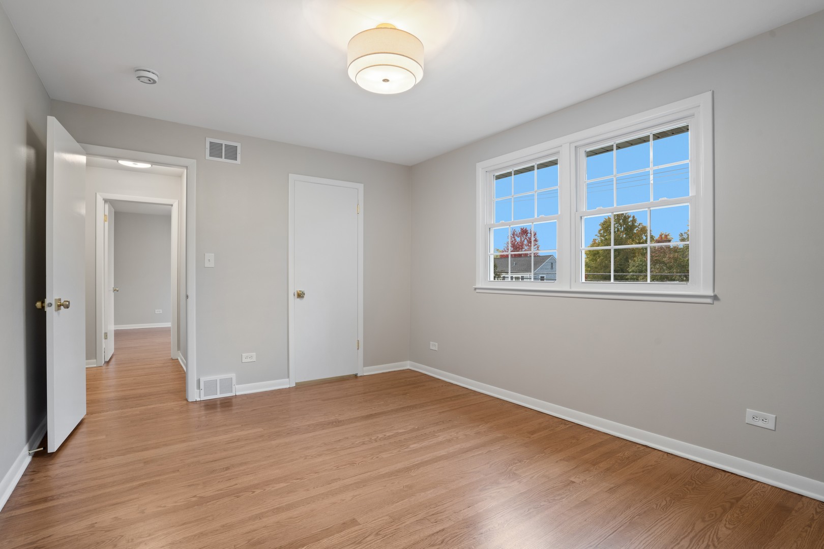 215 45th Street Western Springs, IL 60558 - Photo 34 of 46 a view of empty room with wooden floor and fan