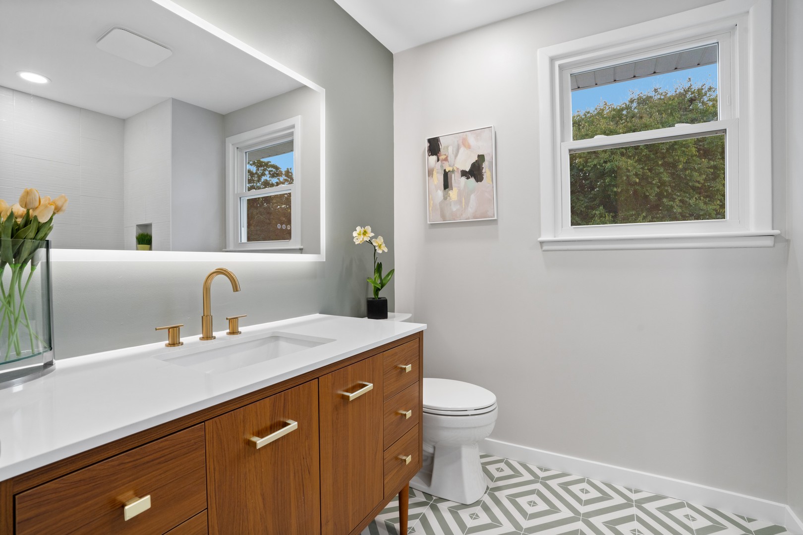215 45th Street Western Springs, IL 60558 - Photo 35 of 46 a bathroom with a granite countertop sink mirror vanity and toilet