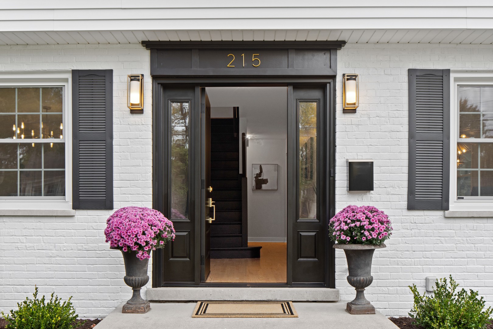 215 45th Street Western Springs, IL 60558 - Photo 4 of 46 a pink flowers in front of a house