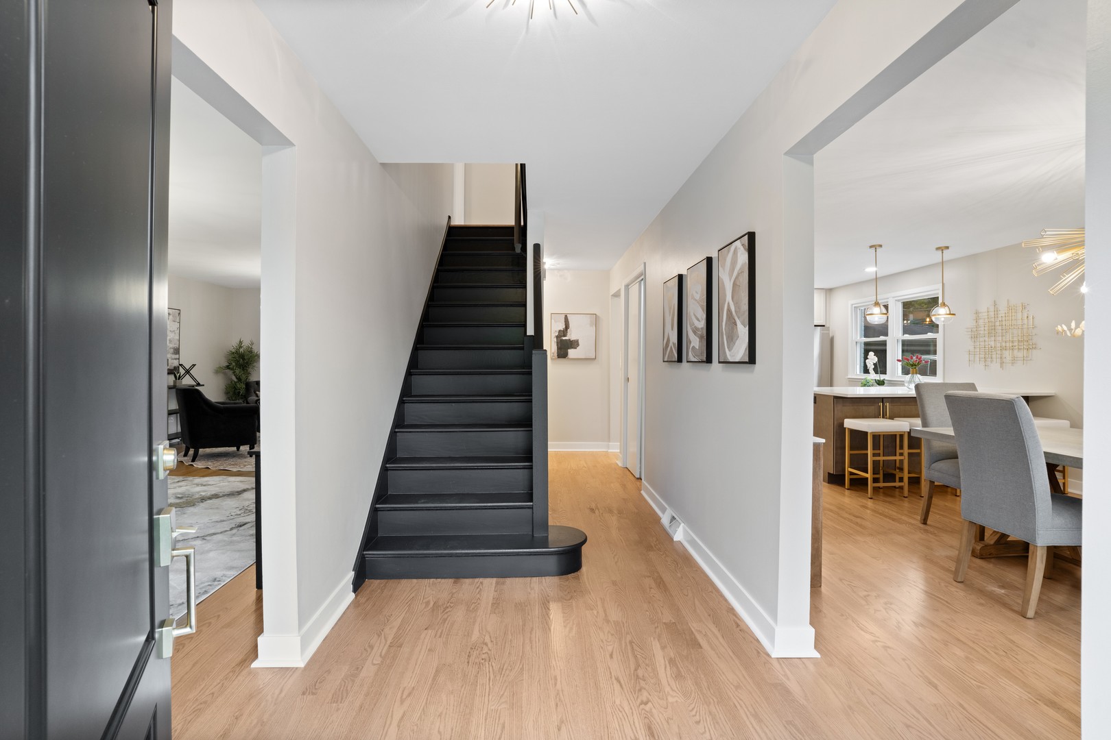 215 45th Street Western Springs, IL 60558 - Photo 5 of 46 a view of a hallway with wooden floor and dining room