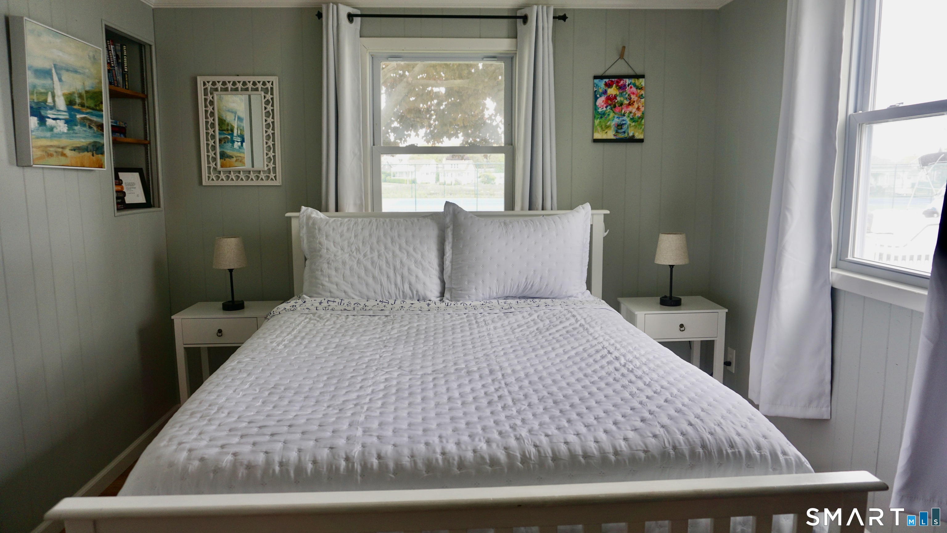 13 Pacific Street Groton, CT 06340 - Photo 26 of 31 a bedroom with a bed and glass window