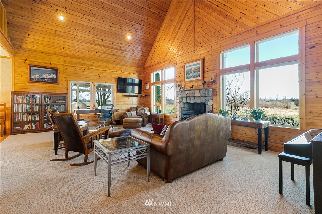 2693 Lindsay Road Everson, WA 98247 - Photo 12 of 40 a living room with furniture and a floor to ceiling window