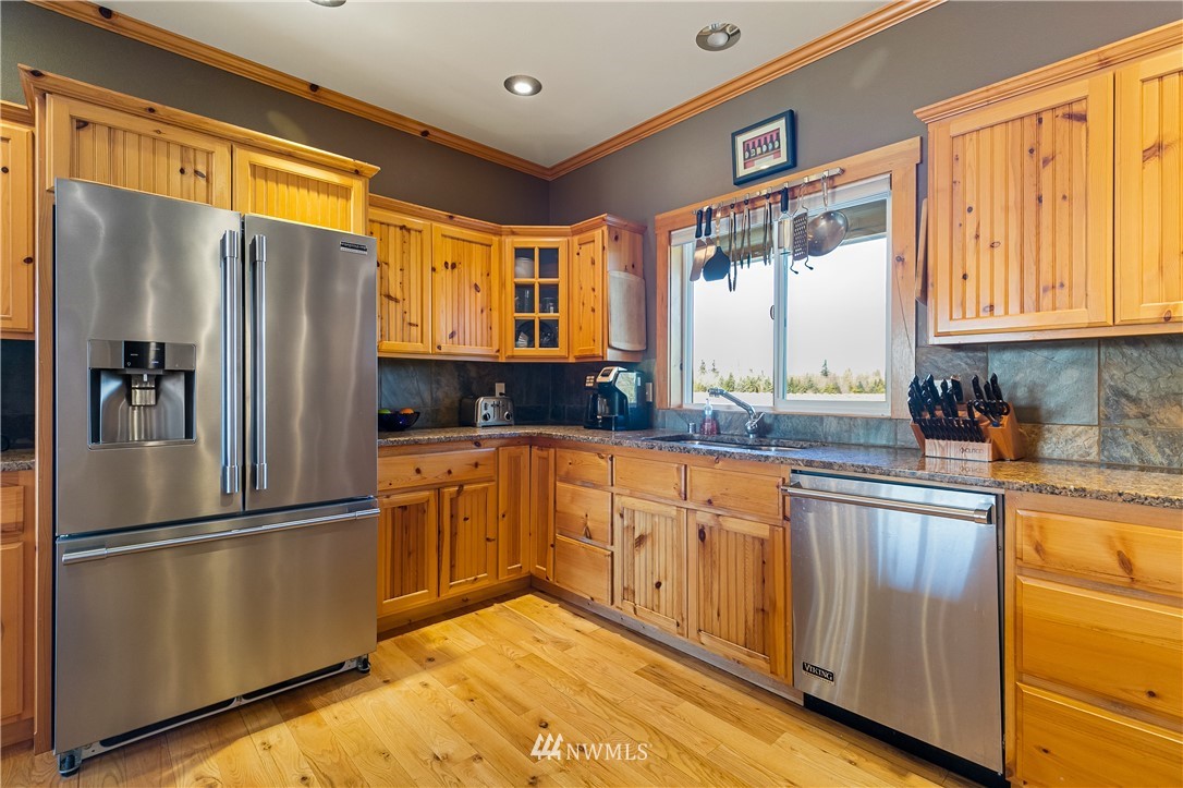 2693 Lindsay Road Everson, WA 98247 - Photo 17 of 40 a kitchen with stainless steel appliances granite countertop a refrigerator and a sink
