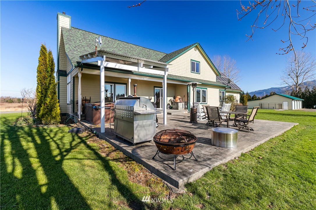 2693 Lindsay Road Everson, WA 98247 - Photo 34 of 40 a view of a house with backyard porch and sitting area