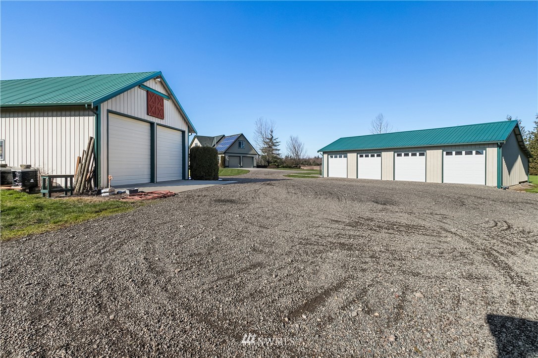 2693 Lindsay Road Everson, WA 98247 - Photo 5 of 40 a view of an house with backyard and trees
