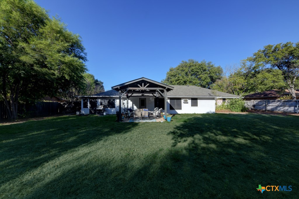 1229 Rapids Road New Braunfels, TX 78130 - Photo 26 of 27 a front view of a house with a garden