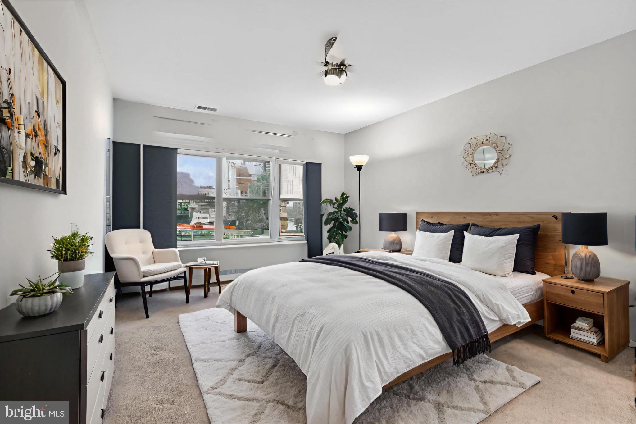 11116 Beaver Trail Court, Unit 11116 Reston, VA 20191 - Photo 10 of 28 a bedroom with a bed and large windows