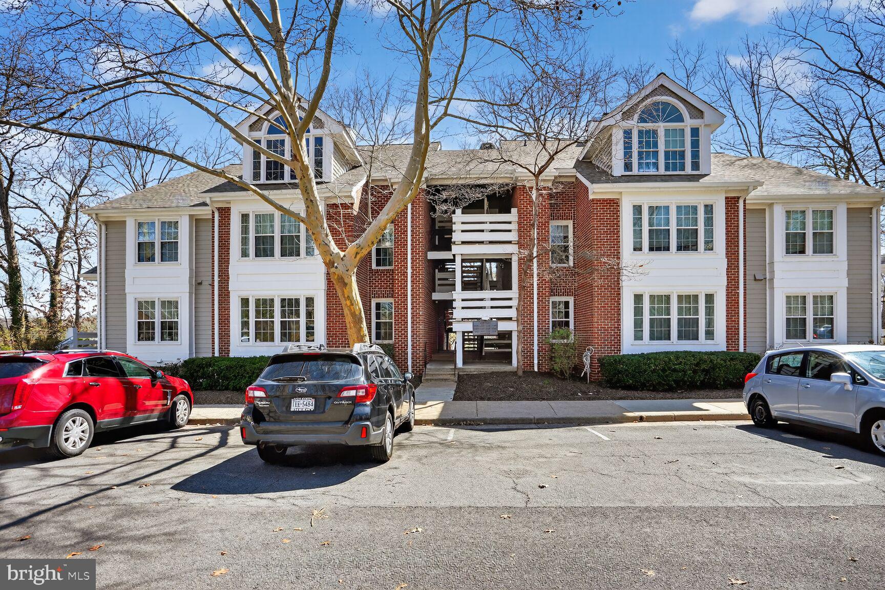 11116 Beaver Trail Court, Unit 11116 Reston, VA 20191 - Photo 2 of 28 a car parked in front of a white building