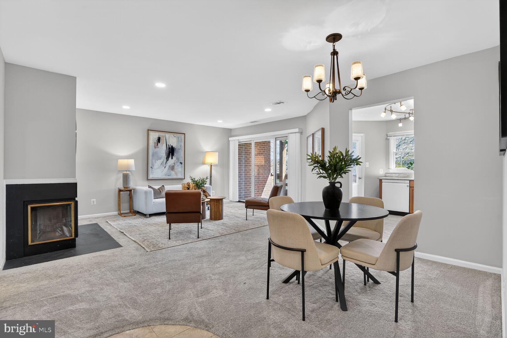 11116 Beaver Trail Court, Unit 11116 Reston, VA 20191 - Photo 4 of 28 a living room with furniture and a fireplace