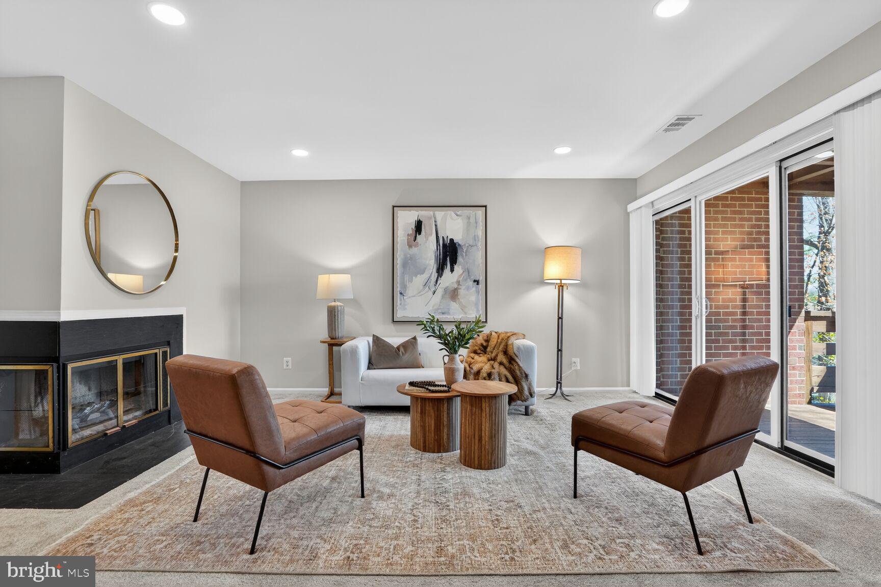 11116 Beaver Trail Court, Unit 11116 Reston, VA 20191 - Photo 5 of 28 a living room with furniture a fireplace and a window