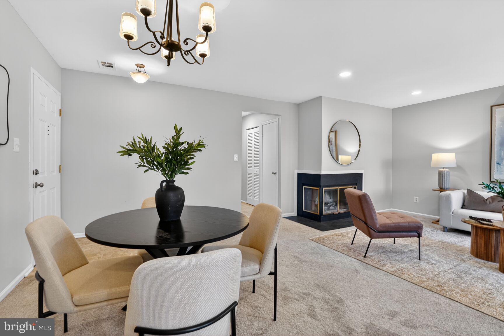 11116 Beaver Trail Court, Unit 11116 Reston, VA 20191 - Photo 8 of 28 a view of a dining room with furniture and wooden floor