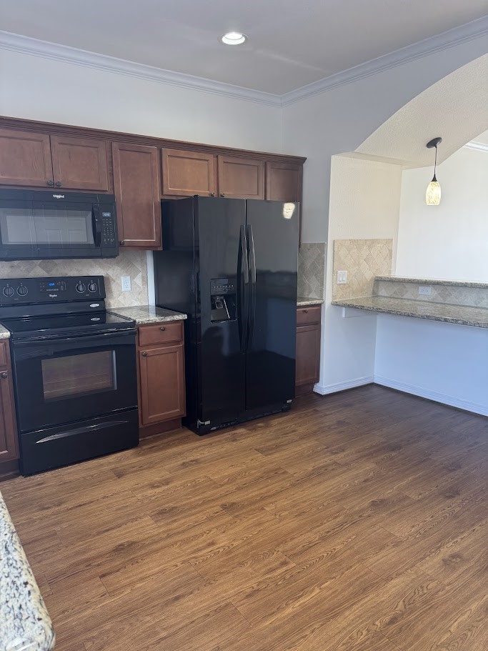 1198 Jones-Butler Road, Unit 1702 College Station, TX 77840 - Photo 5 of 19 a kitchen with stainless steel appliances granite countertop a refrigerator and a stove top oven