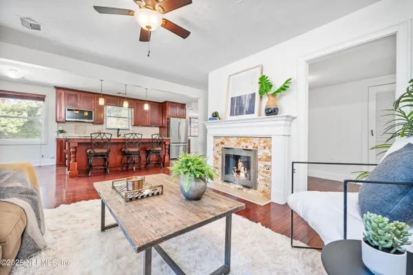 a living room with furniture and a fireplace