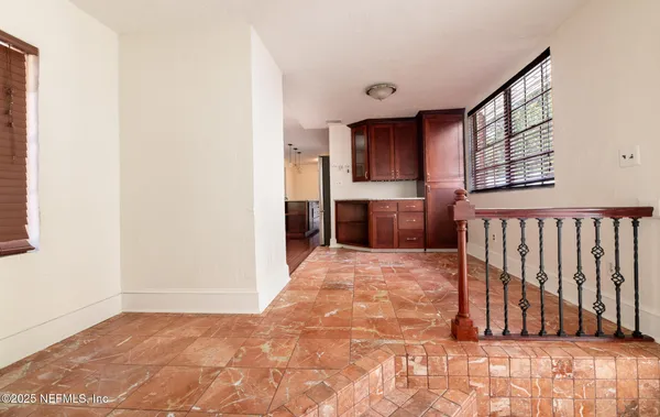 a view of kitchen with furniture and window