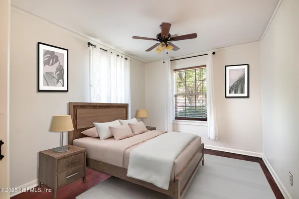 a bedroom with a bed and a window