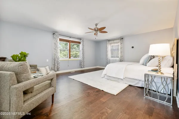 a bedroom with a large bed and furniture