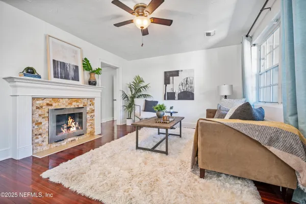a living room with furniture and a fireplace