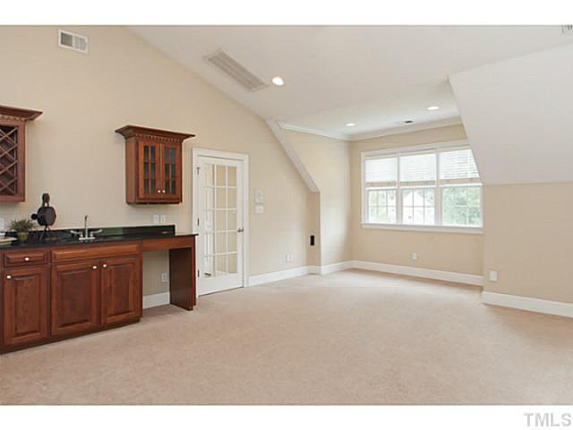 1013 Quiet Ridge Circle Raleigh, NC 27614 - Photo 11 of 15 Equipped with WET BAR and SEPARATE STAIRWELL off kitchen makes this a perfect FLEX SPACE. Bonus Room