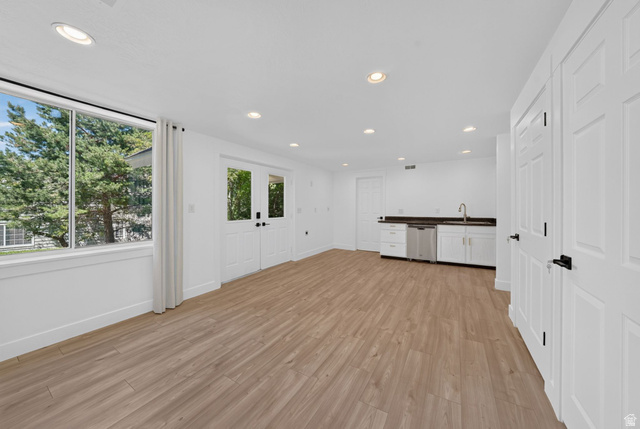 1979 Cave Hollow Way Bountiful, UT 84010 - Photo 39 of 59 Spacious room with wood-finish flooring, recessed lighting, and a prominent window