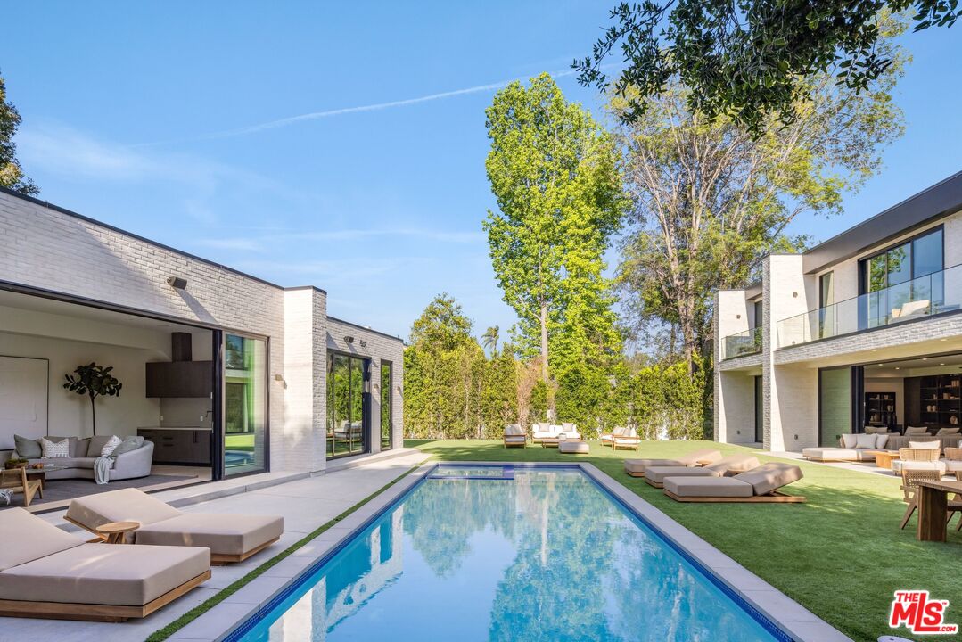 17055 Rancho Street Encino, CA 91316 - Photo 43 of 73 a view of a house with backyard and sitting area
