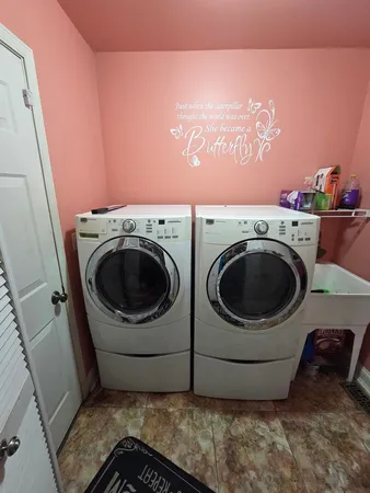 a utility room with dryer and washer