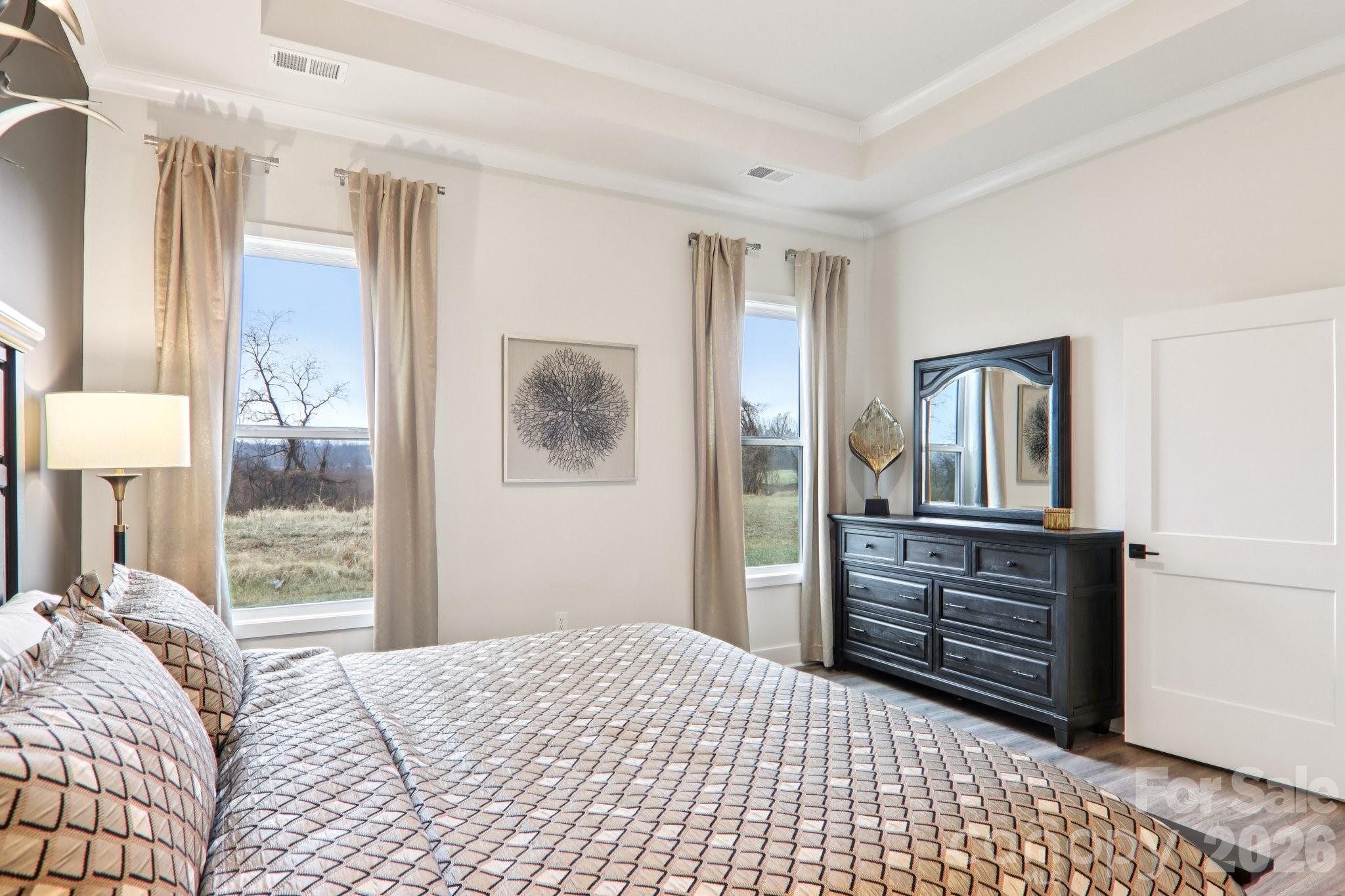 201 Piney Wds Road Fletcher, NC 28732 - Photo 26 of 47 a bedroom with a bed dresser and a window