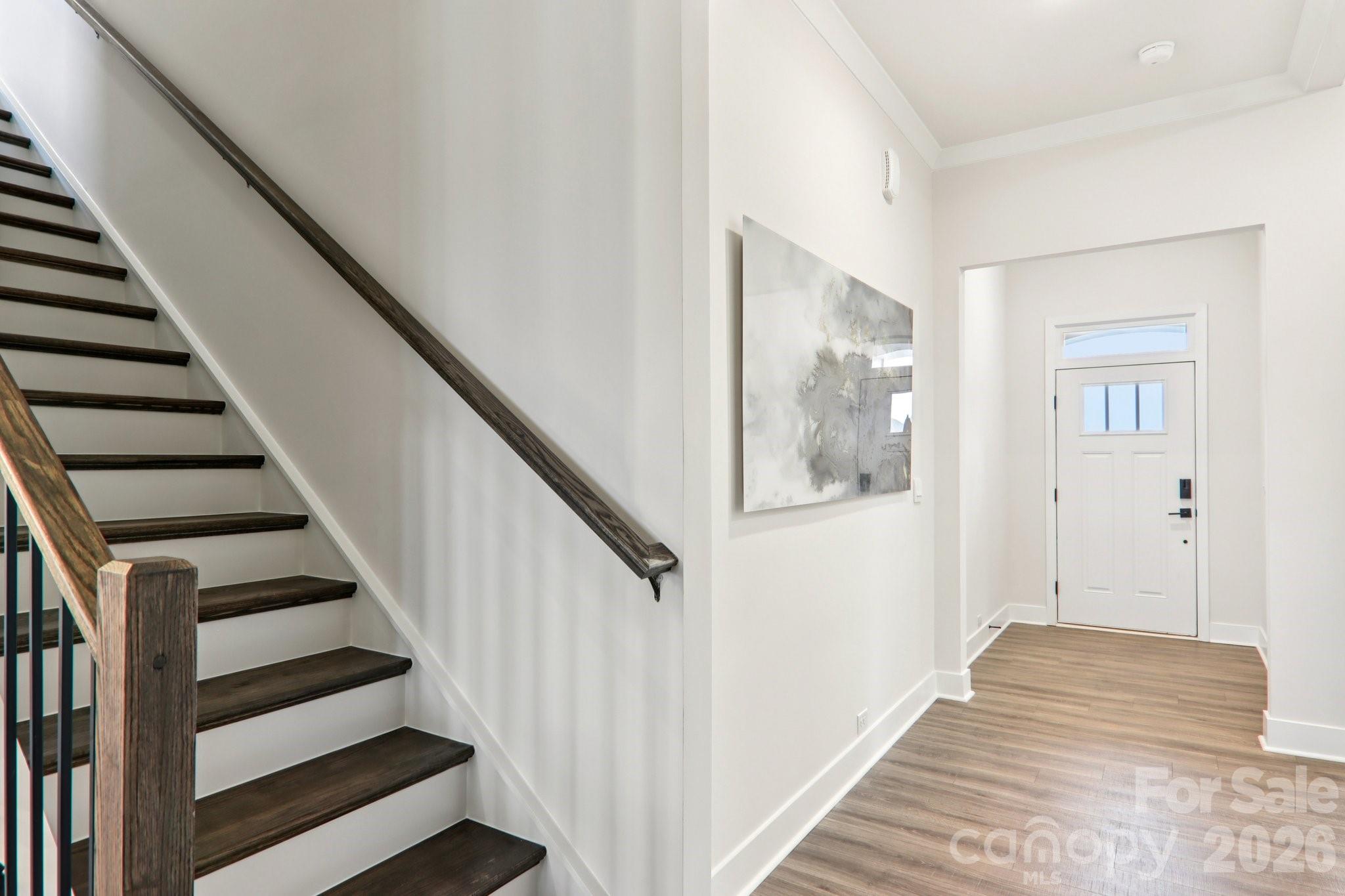 201 Piney Wds Road Fletcher, NC 28732 - Photo 3 of 47 a view of entryway with wooden floor and stairs