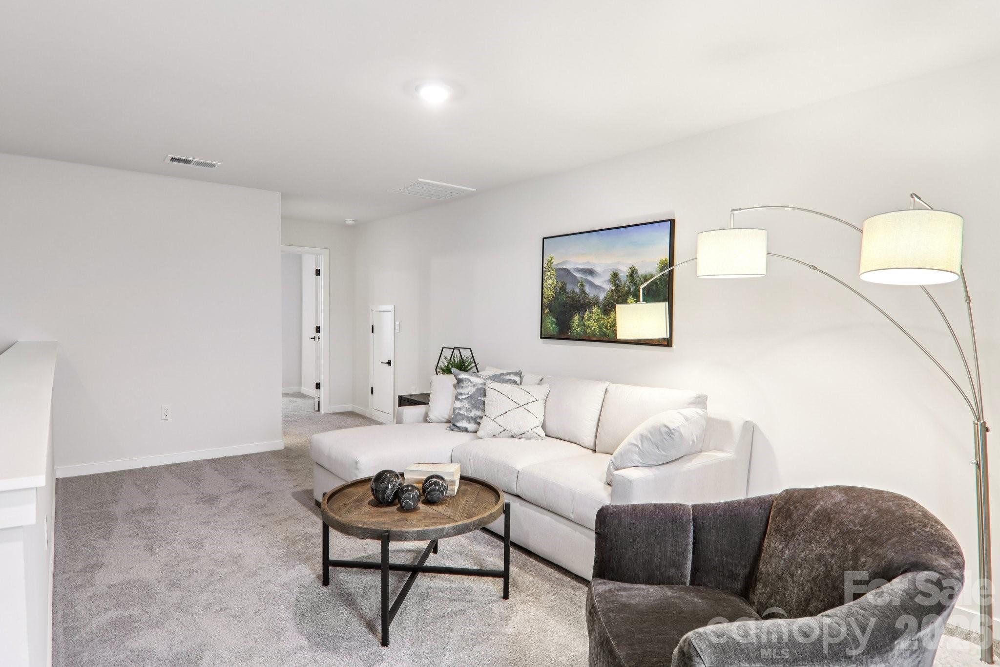 201 Piney Wds Road Fletcher, NC 28732 - Photo 42 of 47 a living room with furniture and a rug