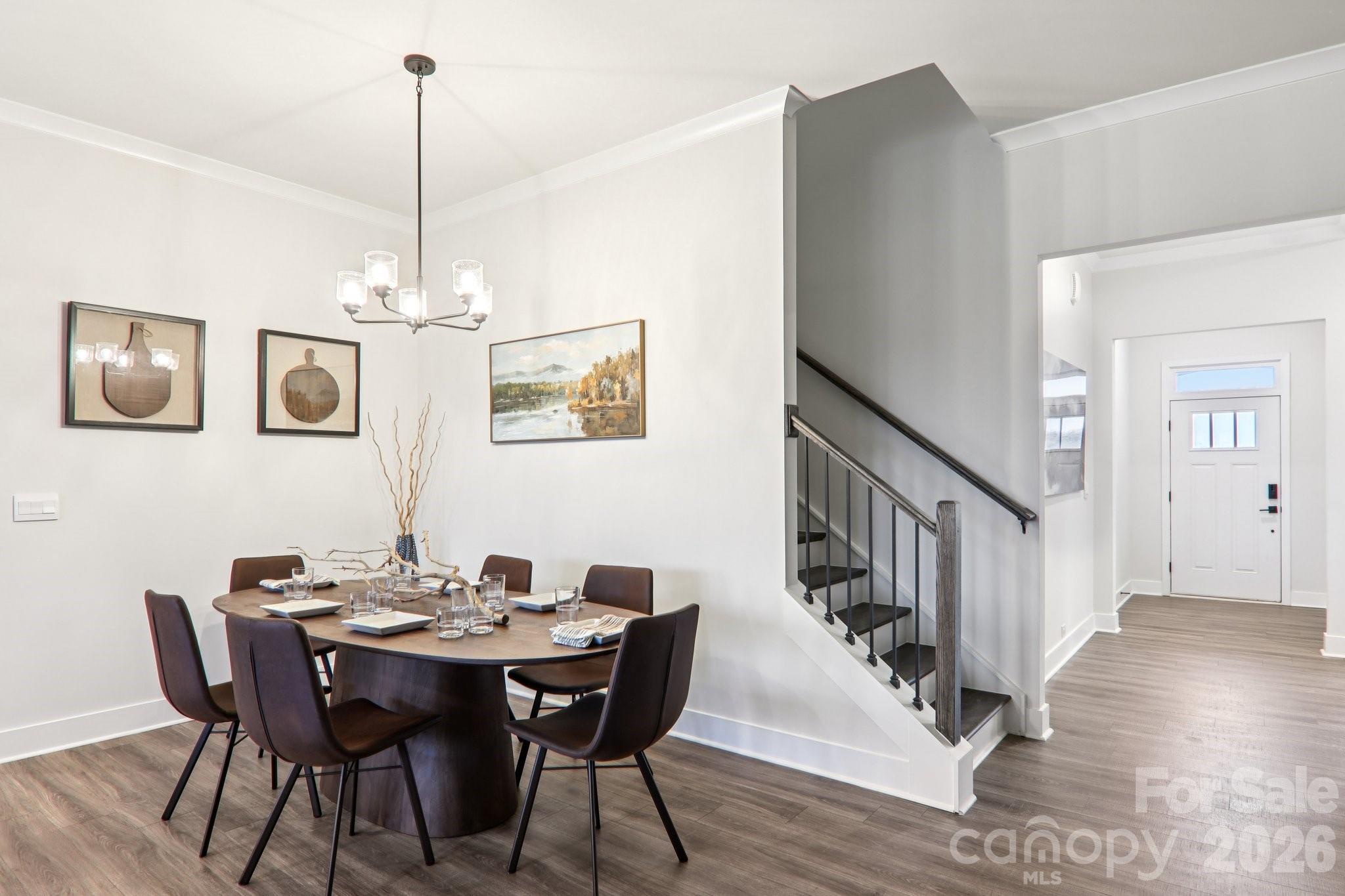 201 Piney Wds Road Fletcher, NC 28732 - Photo 7 of 47 a view of a dining room with furniture wooden floor and chandelier