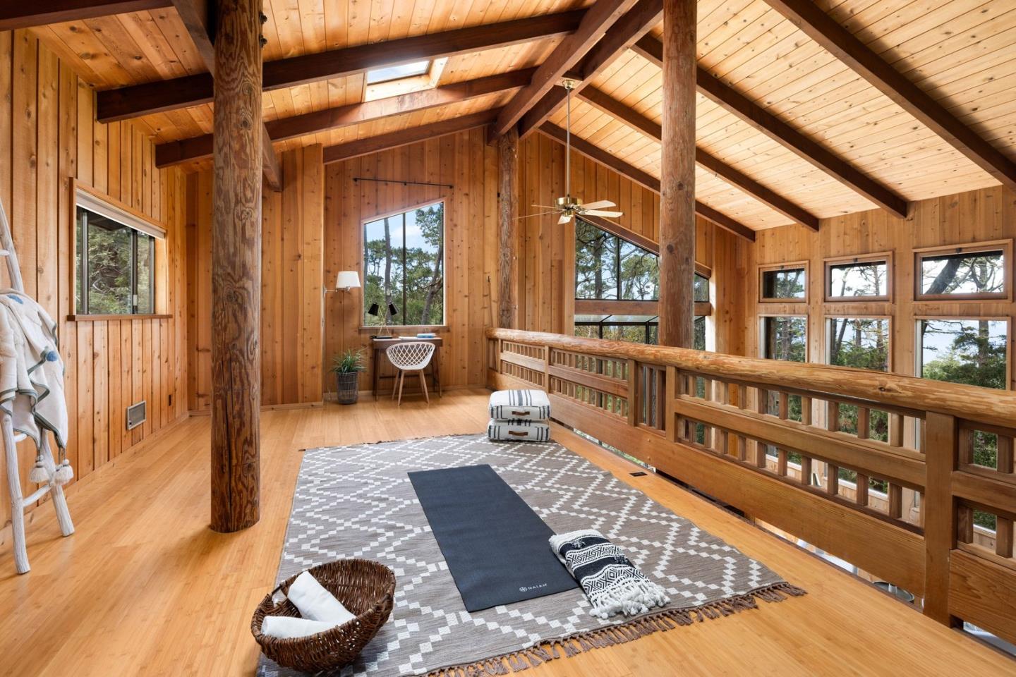73 Mt Devon Road Carmel Highlands, CA 93923 - Photo 28 of 88 a view of a balcony with chairs and wooden floor