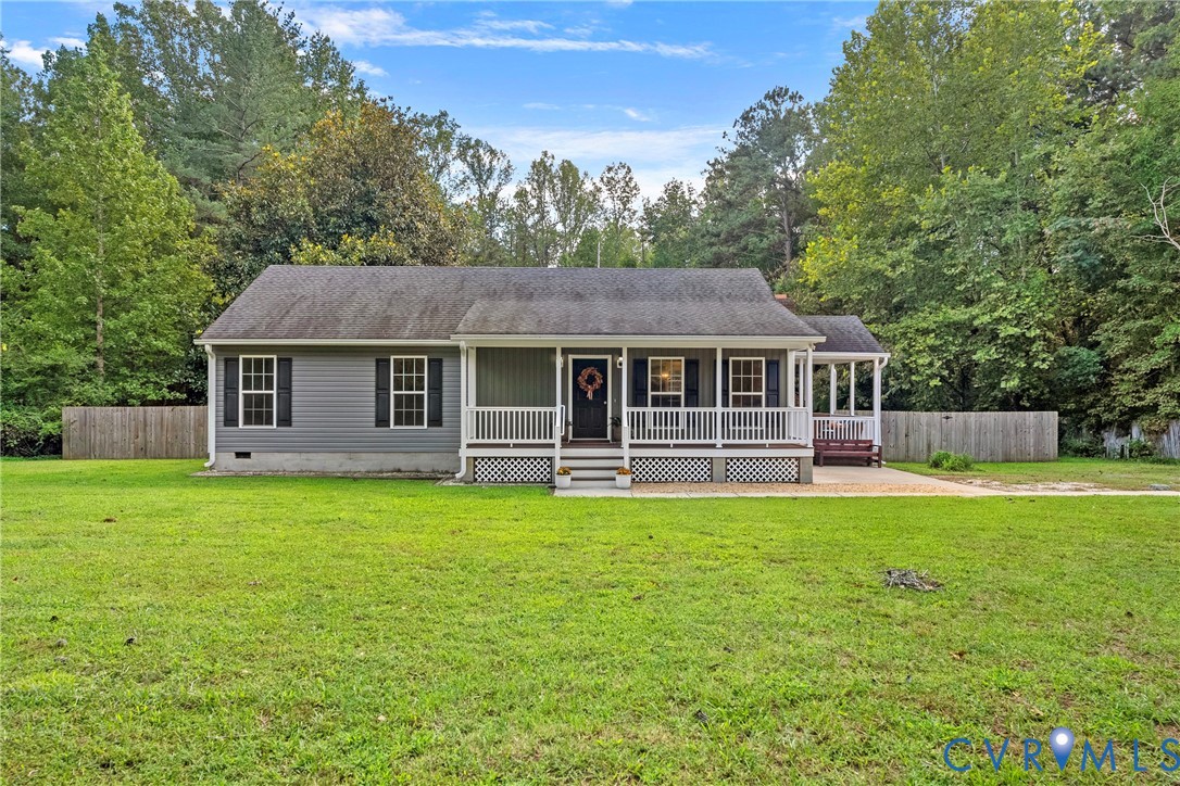 Ranch-style exterior with gray siding and white tr