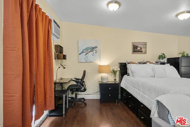 a room with a bed and a desk