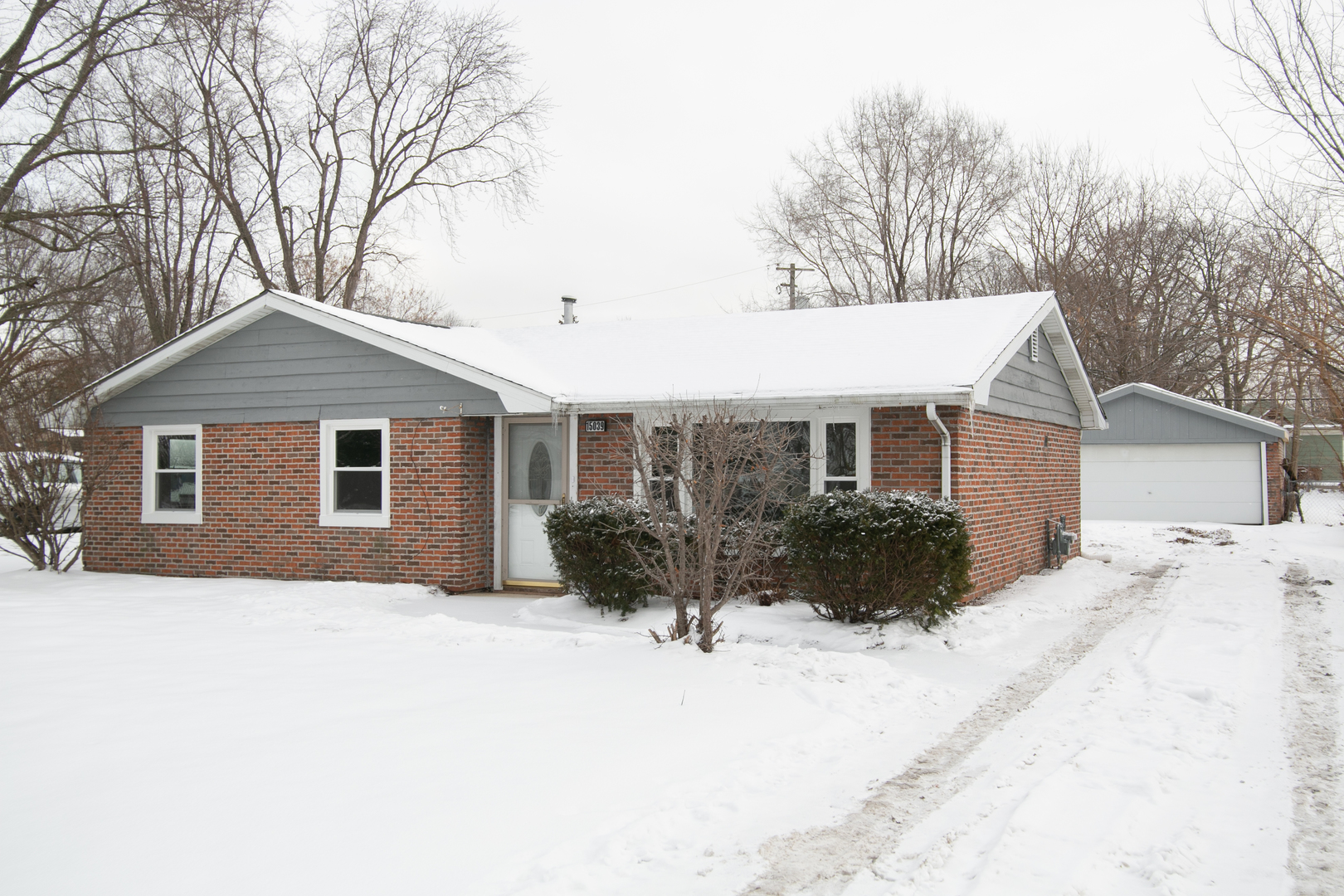 15039 Copter Lane Romeoville, IL 60446 - Photo 1 of 17 a front view of a house with a yard covered in snow