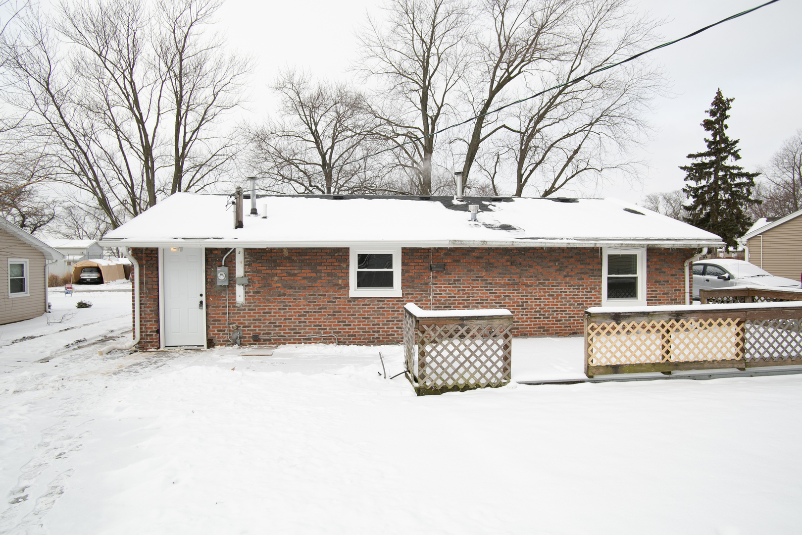 15039 Copter Lane Romeoville, IL 60446 - Photo 4 of 17 a front view of a house with a yard covered in snow