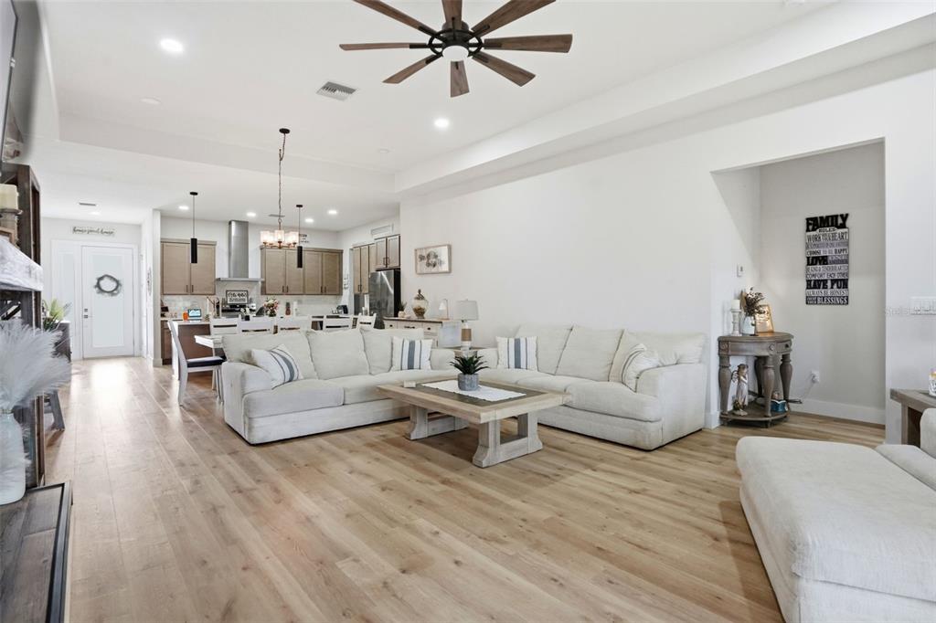 9013 Mississippi Run Weeki Wachee, FL 34613 - Photo 25 of 99 a living room with furniture and kitchen view