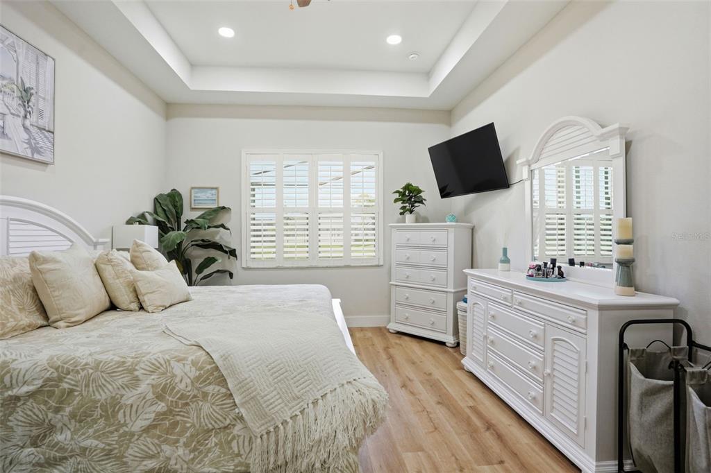 9013 Mississippi Run Weeki Wachee, FL 34613 - Photo 30 of 99 a bedroom with a bed and flat screen tv