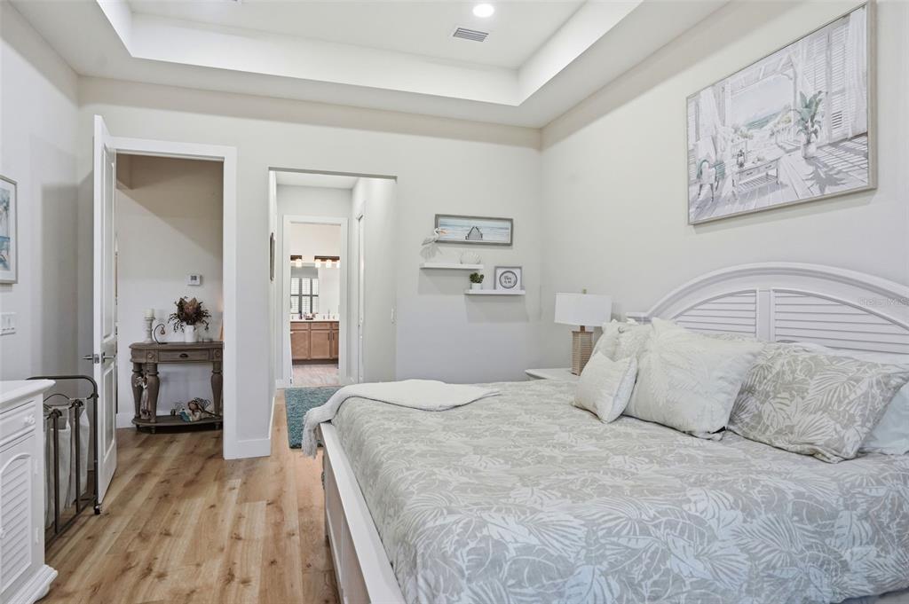 9013 Mississippi Run Weeki Wachee, FL 34613 - Photo 31 of 99 a bedroom with a large bed and a view of bedroom