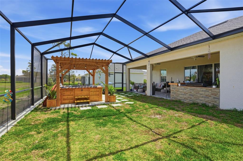 9013 Mississippi Run Weeki Wachee, FL 34613 - Photo 54 of 99 a view of a backyard with sitting area