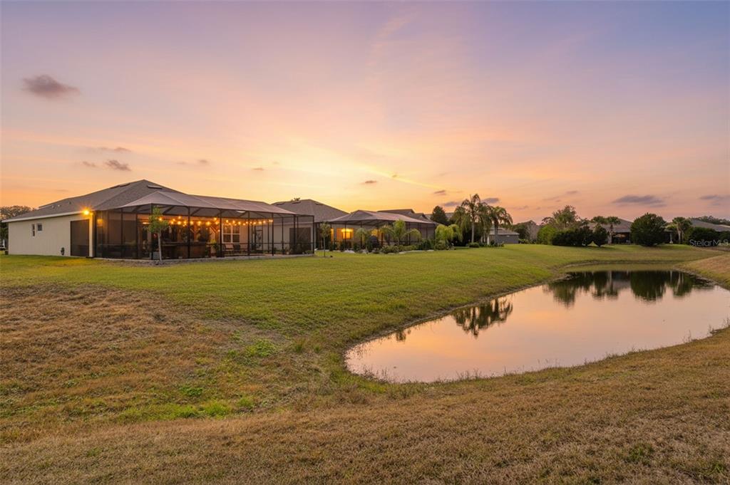 9013 Mississippi Run Weeki Wachee, FL 34613 - Photo 64 of 99 a view of a lake with houses in the background